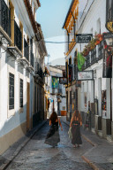 Tourists in narrow pedestrian streets of Cordoba, Andalucia, Spain
