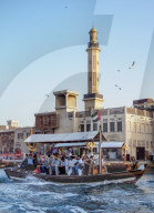 Abra Boat on Dubai Creek, Bur Dubai Grand Mosque in the background, Dubai, United Arab Emirates