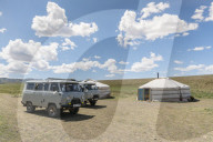 Mongolian traditional nomadic gers and soviet minivans. Bayandalai district, South Gobi province, Mongolia.