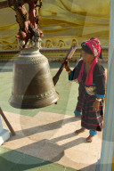 Buddhist bell and devotee, Bagan, Myanmar