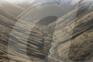 View down Langdale Valley to snow capped Cobles in winter in the Howgill Fells near Sedbergh, Cumbria, UK