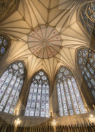 The decorative chapter house ceiling and its stained glass windows inside York Monster, York, North Yorkshire