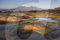 The Isle of Rum from Singing Sands on the Isle of Eigg, Small Isles, Inner Hebrides, Scottish Highlands, Scotland, UK