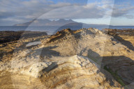 The Isle of Rum from Singing Sands on the Isle of Eigg, Small Isles, Inner Hebrides, Scottish Highlands, Scotland, UK