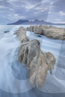 The Isle of Rum from Singing Sands on the Isle of Eigg, Small Isles, Inner Hebrides, Scottish Highlands, Scotland, UK