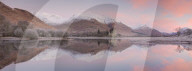 Stitched panoramic image of Kilchurn Castle and Loch Awe at sunrise with snow capped mountains in winter Argyll & Bute Scotland