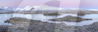 Pink sunrise and snow covered Black Mount from a frozen Lochan-na h'achlaise, Rannoch Moor, Glencoe, Highlands, Scotland