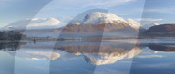 Snow capped ben Nevis reflecting on the calm surface of Loch Linnhe at Corpach near Fort William Highlands Scotland