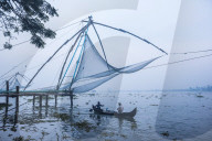 Fishermen at the traditional Chinese fishing nets, Fort Kochi (Cochin), Kerala, India