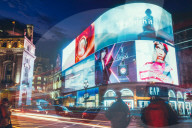 Traffic trails and advertisements at night near Piccadilly Circus, London, England, United Kingdom, Europe