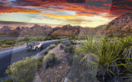 Car driving through The Red Rock Canyon National Recreation Area at sunset, Las Vegas, Nevada, USA, North America