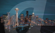 Seattle city skyline at night with urban office buildings and Space Needle viewed from garden near Kerry Park. Washington, USA