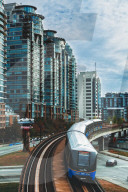 Sky Train metro, apartment buildings and Cars stacked as modern art exhibition, Vancouver, Canada, British Columbia, America.