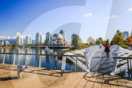 View of False Creek and city skyline, World of Science Dom, people walking, Vancouver, British Columbia, Canada, North America