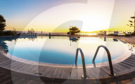 Largre swimming pool ans sunset over Chania, Crete, Greek Islands, Greece, Europea