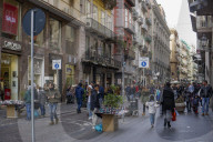 Naples, Italy - Via Toledo. Crowd along busy shopping street with shops and street vendors in Napoli.