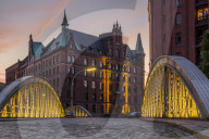 View from the Neuerwegsbruecke to the Sandtorkai-Hof building at the Speicherstadt (Warehouse complex) in Hamburg at sunset