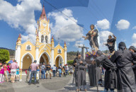 Good Friday procession approaching a sawdust carpet during Holy Week 2017 in Antigua