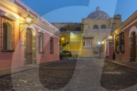 Colonial houses and the La Merced cathedral in Antigua at dawn