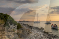 Boat anchoring at Pokonji Dol Beach near Hvar Town at sunset