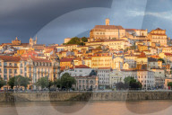 View from Mondego River to the old town with the university on top of the hill at sunset, Coimbra, Portugal, Europe
