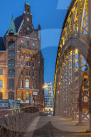 Typical building of the Speicherstadt (Warehouse complex) and KornhausbrÃ¼cke (Kornhaus Bridge) in Hamburg at dusk