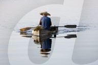 Fisherman on small rowing boat made of Polystyrene blocks, Cienfuegos, UNESCO World Heritage Site, Cuba, West Indies, Caribbean