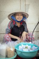 Vietnamese woman cooking on the street