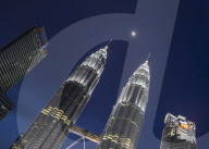 Petronas Twin Towers with the moon showing in between