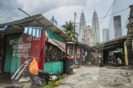 Side street in Kampung Baru with the Petronas Twin Towers in the background