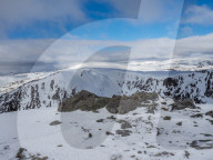 On the summit of The Cairnwell in the Cairngorm National Park looking over the glen to Carn a' Gheoidh in the distance