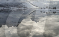 Winter reflections in a fjord in the Lofoten Islands