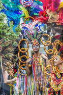 A colourfully dressed participant taking part in the Notting Hill Carnival, London, United Kingdom, Europe.