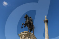 The Charles I statue and Nelsons Column in Trafalgar Square in London, England, United Kingdom, Europe.