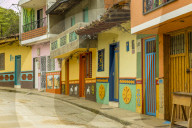A typically colourful street with traditional buildings, in the picturesque town of Guatape in Colombia.