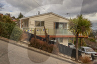 Baldwin Street, the world's steepest residential road. It has an average gradient of 1 to 5 and is 350 metres long.