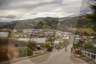 Tourists at Baldwin Street, the world's steepest residential road. It has an average gradient of 1 to 5 and is 350 metres long.