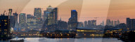 Canary Wharf and City Square Mile panorama from Royal Victoria dock dock