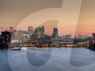 Canary Wharf and City Square Mile cityscape from Royal Victoria dock