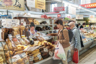 Shopping at the baker's in the covered Central Market, converted Zeppelin hangars), Riga, Latvia