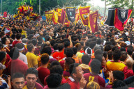 Flag carriers lead final procession of the Black Cross & Jesus at annual Feast of the Black Nazarene across Manila, Philippines