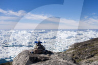 Blue trail Holms Bakke hike beside Ilulissat Icefjord with icebergs from Jakobshavn Glacier, A UNESCO World Heritage site
