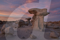 Hoodoos at dawn under red clouds, Bisti Wilderness, New Mexico, USA