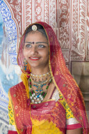 India, Rajasthan, Jaipur, Samode Palace, lady wearing a colourful Sari in ornate passageway - Model and Property released