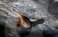 A rock climber in action on cliffs at Rodellar, Spain
