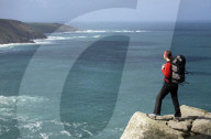 A woman hiking at Bosigran, Cornwall