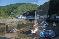 Boats at low tide in the harbour at Lynmouth, Exmoor Coast, North Devon