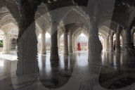 Woman in red sari in the marble pillared hall of Shri Swaminarayan temple, built after the 2001 earthquake, Bhuj, Gujarat