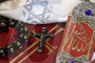 Christianity, buddhism, Islam and Judaism. Interfaith symbols : bible, cucifix, Kippah, Allah monogram and mala.