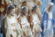 Shop selling religious christian items. Jesus statues. Ho Chi Minh City. Vietnam.